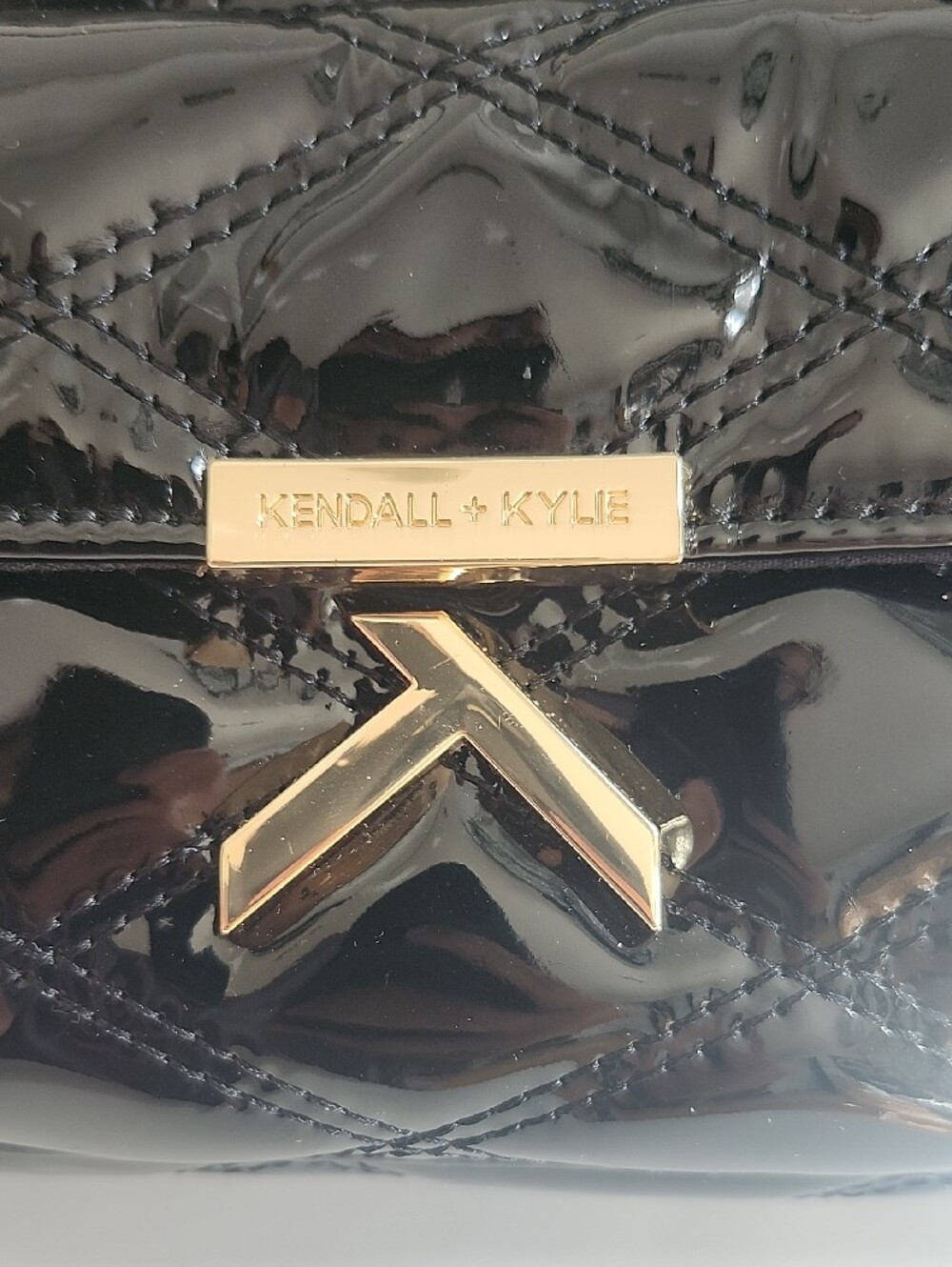 Kendall & Kylie Shiny Black Quilted Patent Wristlet with Gold Hardware - Picture 2 of 6